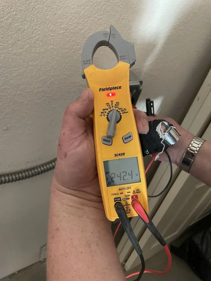 Voltage testing with clamp meter during Generator Installation in Sault Ste. Marie